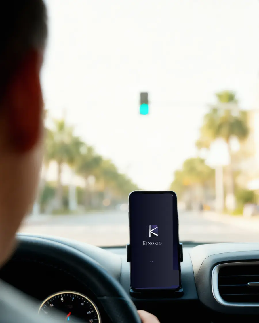 A Goweay driver on the road with the app mounted on the dashboard